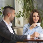Happy young couple at coffee shop