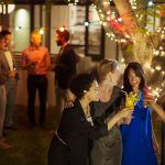 Friends toasting each other at party