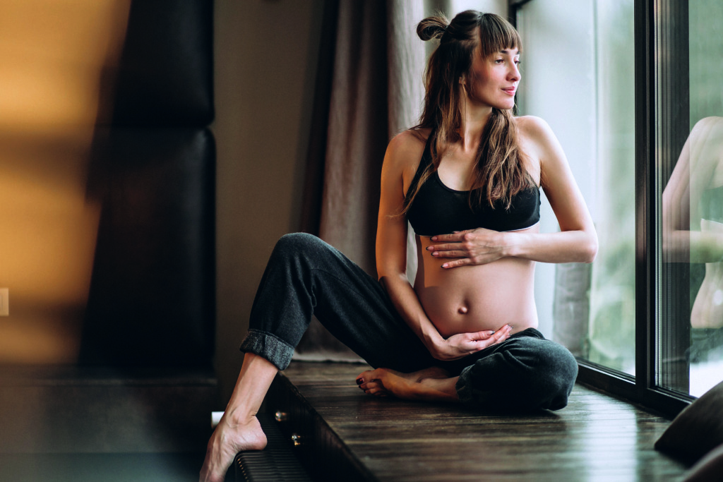 Pregnant woman practicing yoga Yoga Prenatal
